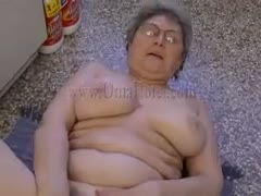 A fat lady uses her sex toy to fuck her pussy while wearing big bra friends.